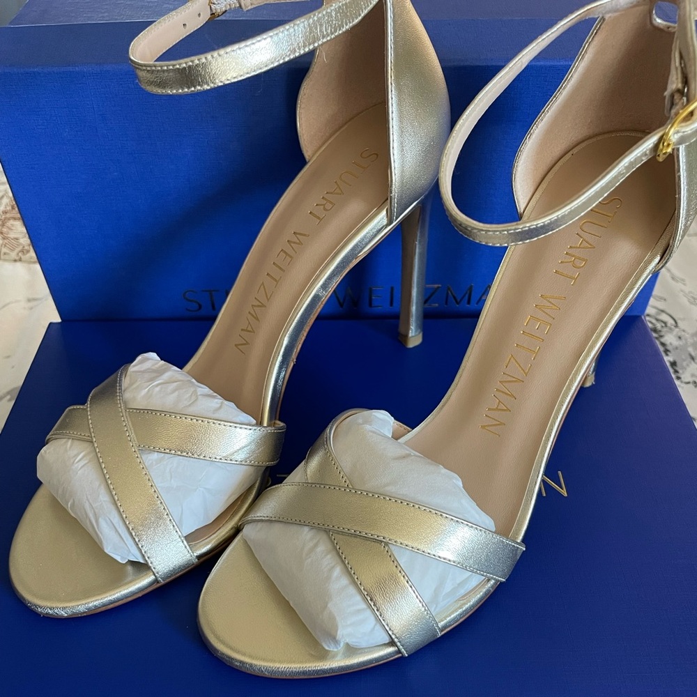 Stuart Weitzman NudistSong Cross 4 inch stiletto sandals in platinum/gold.
